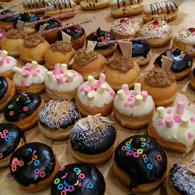 Rows of Sufganiyot, similar in appearance to jelly donuts